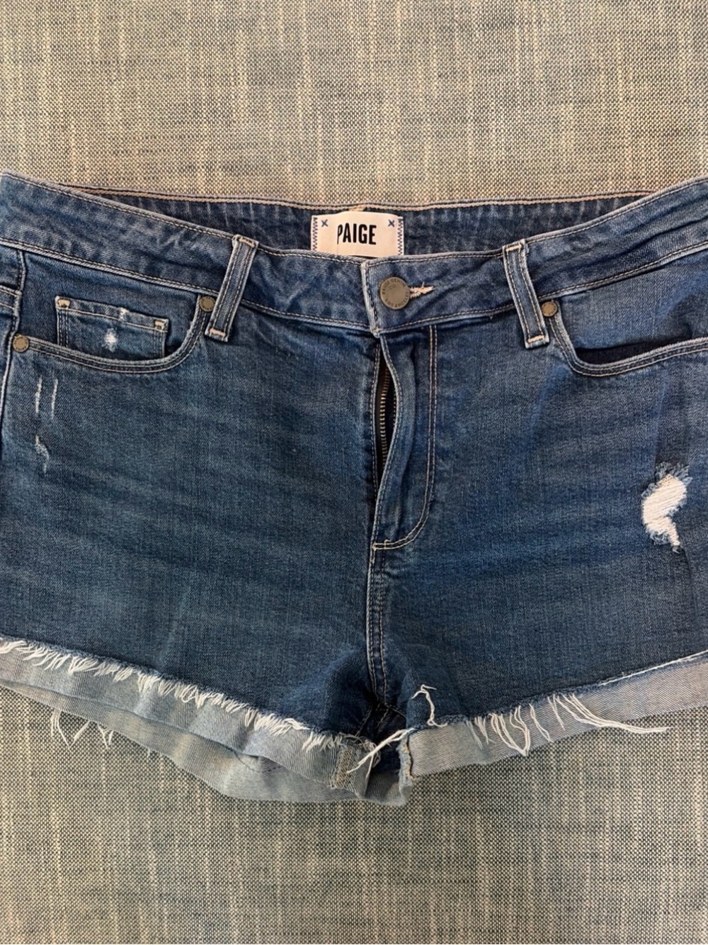 PAIGE Distressed Blue Denim Cutoff Shorts